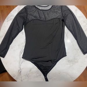 Black mesh long sleeve bodysuit. Fits like L/XL